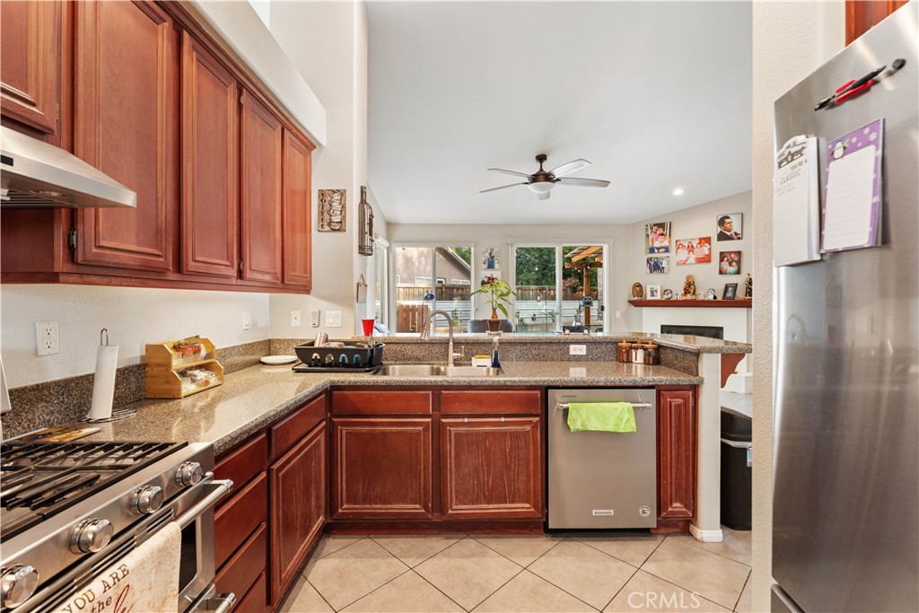 236 Jam Street Hemet, CA 92544 - Photo 16 of 36 a kitchen with stainless steel appliances a sink stove and refrigerator