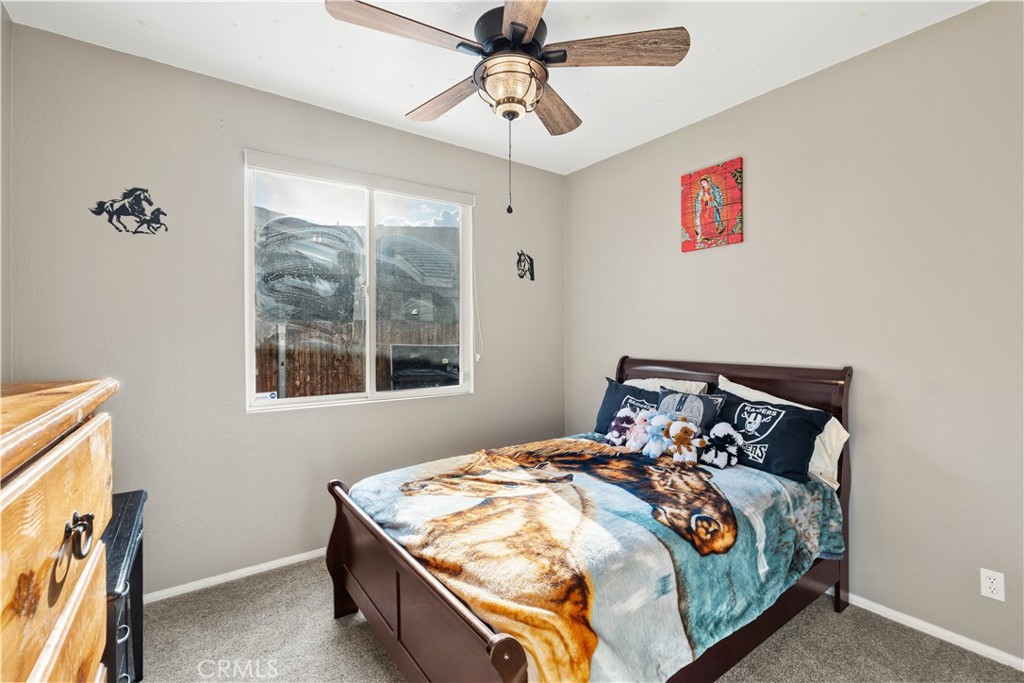 236 Jam Street Hemet, CA 92544 - Photo 21 of 36 a bed sitting in a bedroom next to a window