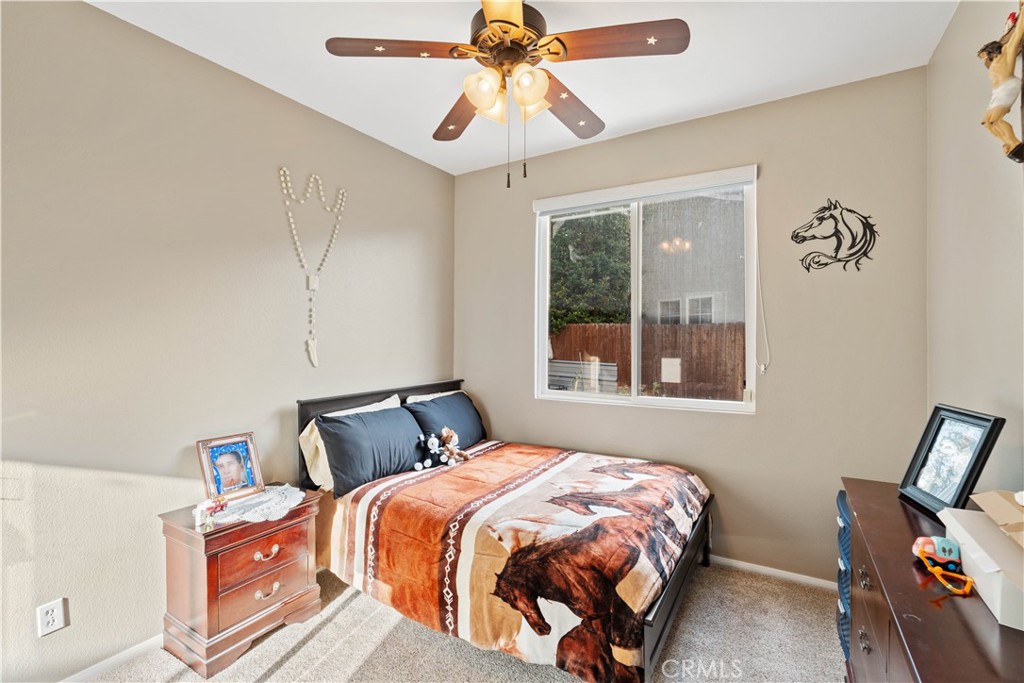 236 Jam Street Hemet, CA 92544 - Photo 23 of 36 a bedroom with a bed and window