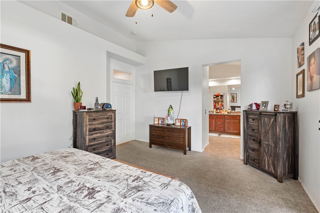 236 Jam Street Hemet, CA 92544 - Photo 26 of 36 a bedroom with a bed and a television