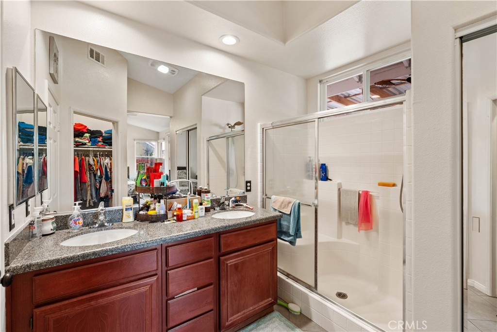 236 Jam Street Hemet, CA 92544 - Photo 28 of 36 a bathroom with a sink double vanity and shower