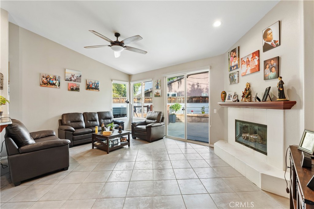 236 Jam Street Hemet, CA 92544 - Photo 6 of 36 a living room with furniture and a fireplace