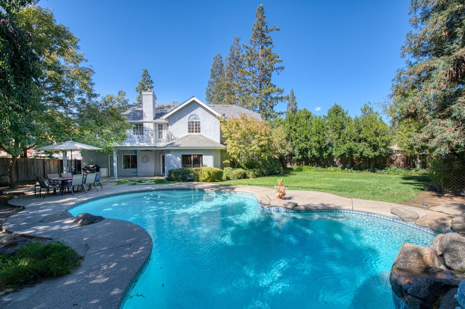 205 West Ridgepoint Drive Fresno, CA 93711 - Photo 1 of 49 a view of a house with backyard and sitting area