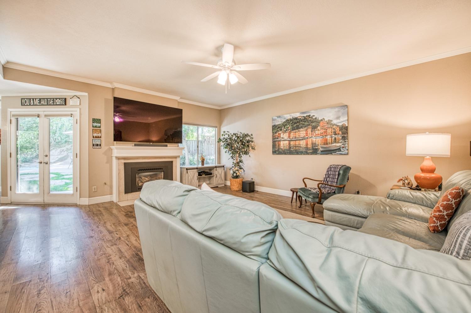 205 West Ridgepoint Drive Fresno, CA 93711 - Photo 14 of 49 a living room with furniture and a flat screen tv