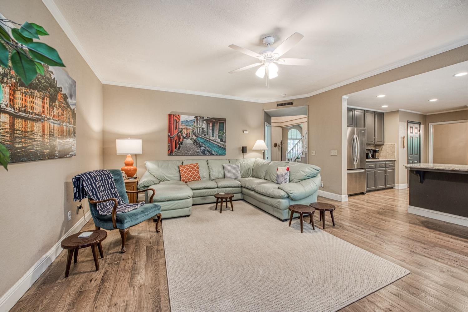 205 West Ridgepoint Drive Fresno, CA 93711 - Photo 16 of 49 a living room with furniture and a chandelier