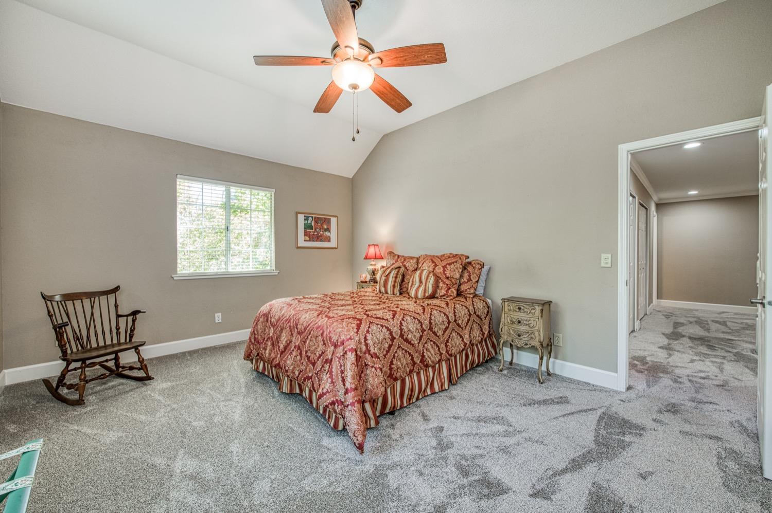 205 West Ridgepoint Drive Fresno, CA 93711 - Photo 28 of 49 a bedroom with a bed and a window