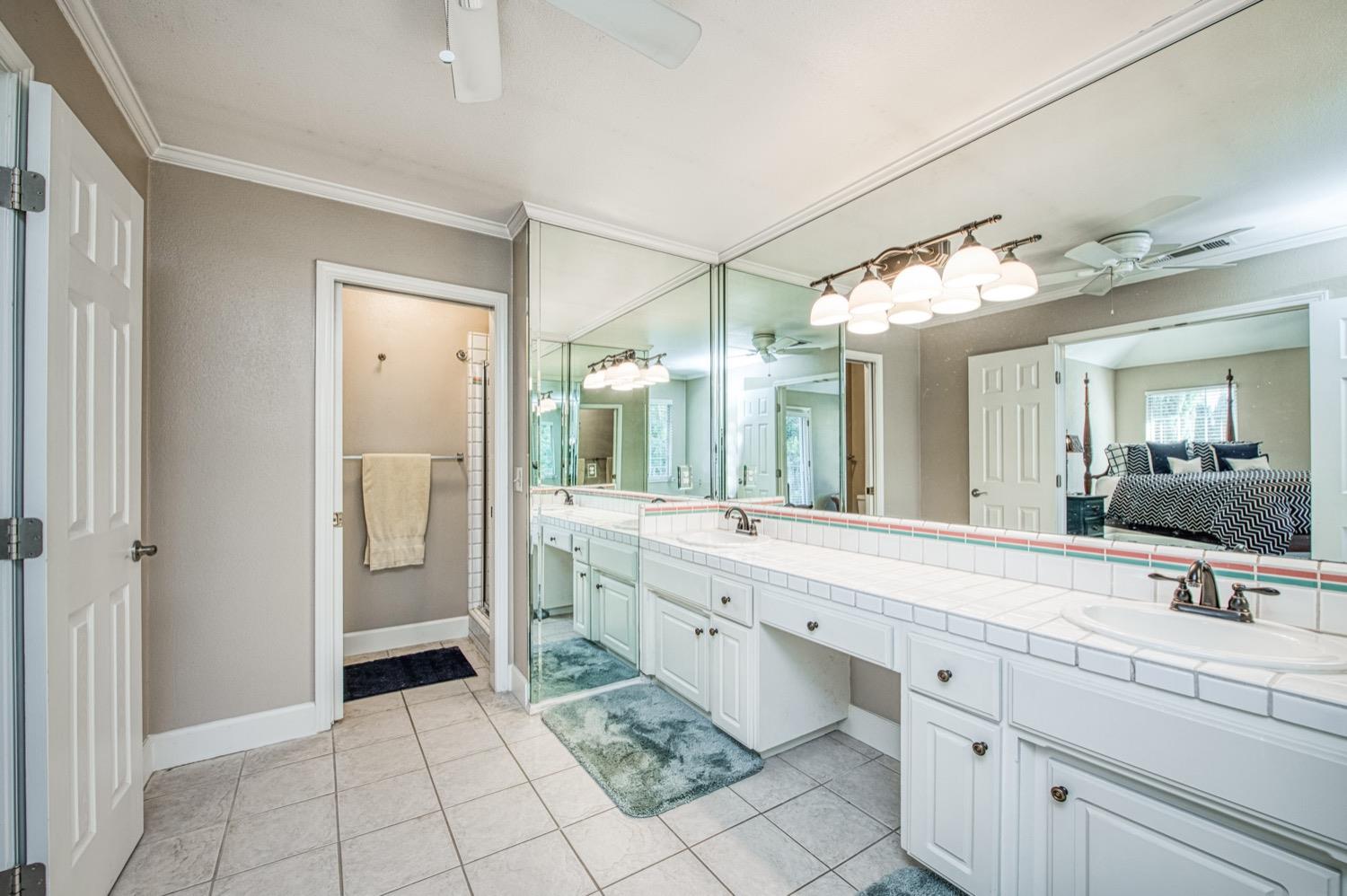 205 West Ridgepoint Drive Fresno, CA 93711 - Photo 36 of 49 a spacious bathroom with a double vanity sink mirror and double