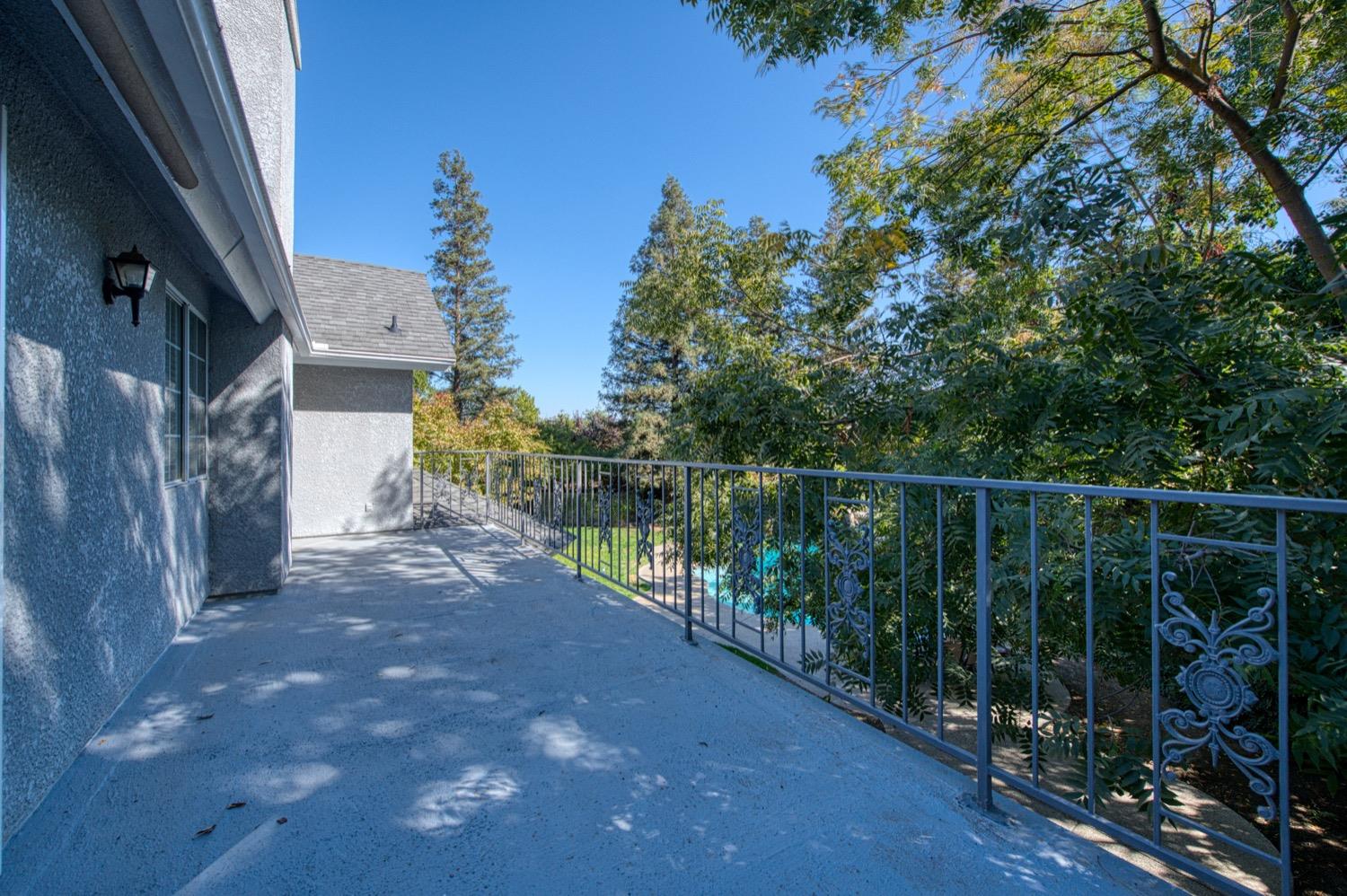 205 West Ridgepoint Drive Fresno, CA 93711 - Photo 38 of 49 a balcony with trees in front of it