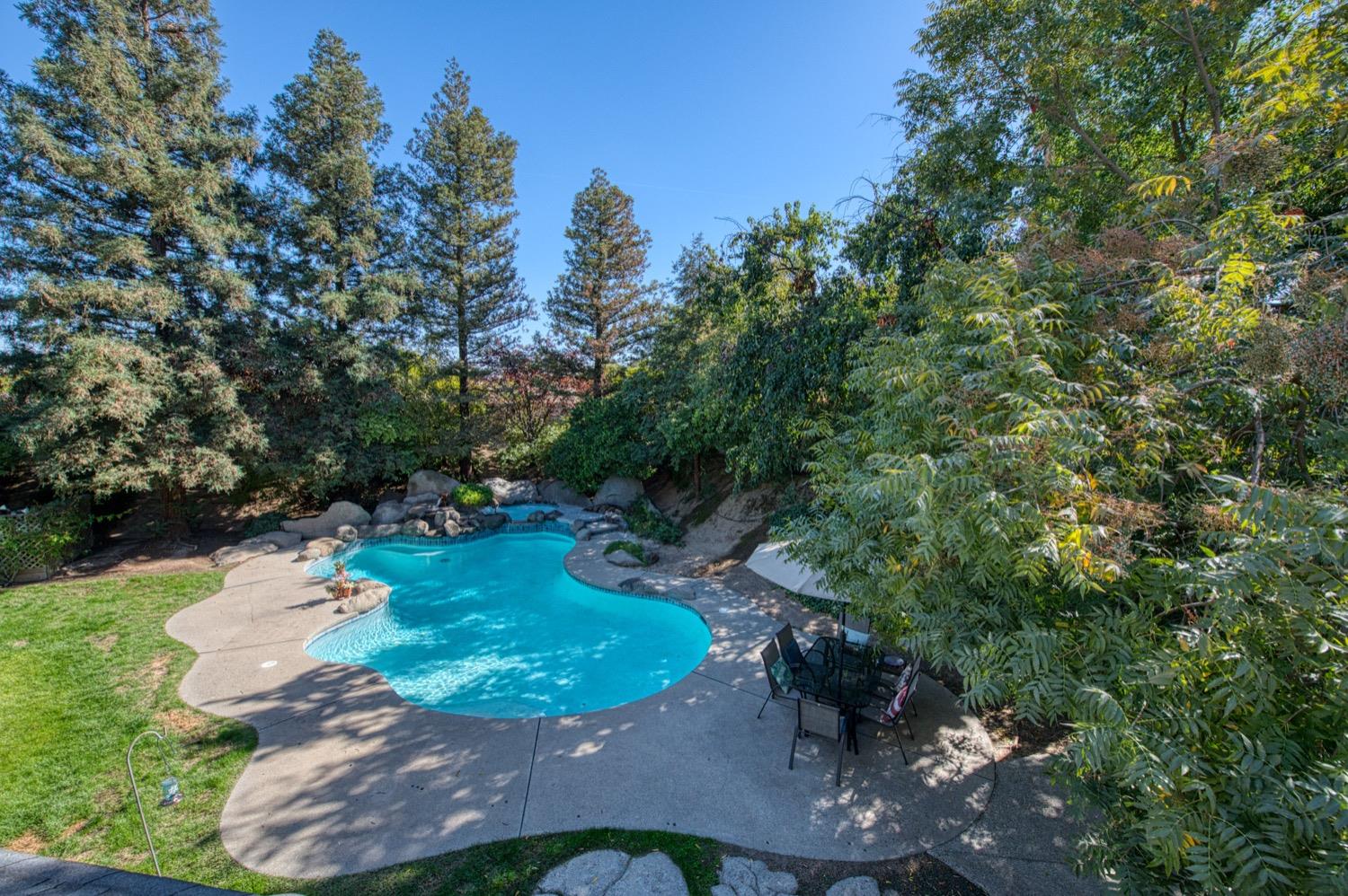205 West Ridgepoint Drive Fresno, CA 93711 - Photo 39 of 49 an aerial view of a house with a yard