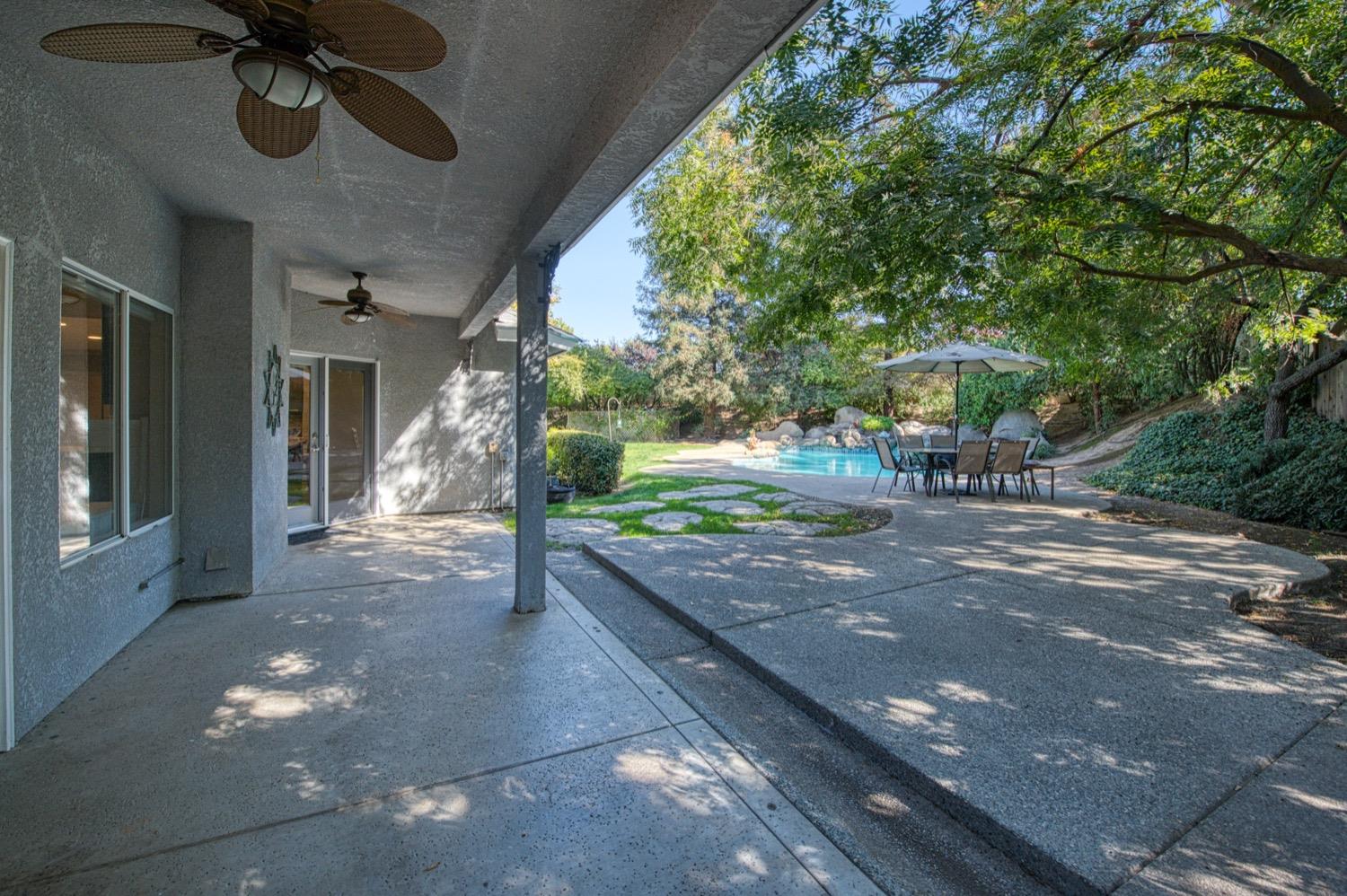205 West Ridgepoint Drive Fresno, CA 93711 - Photo 42 of 49 a view of a porch with furniture and a yard