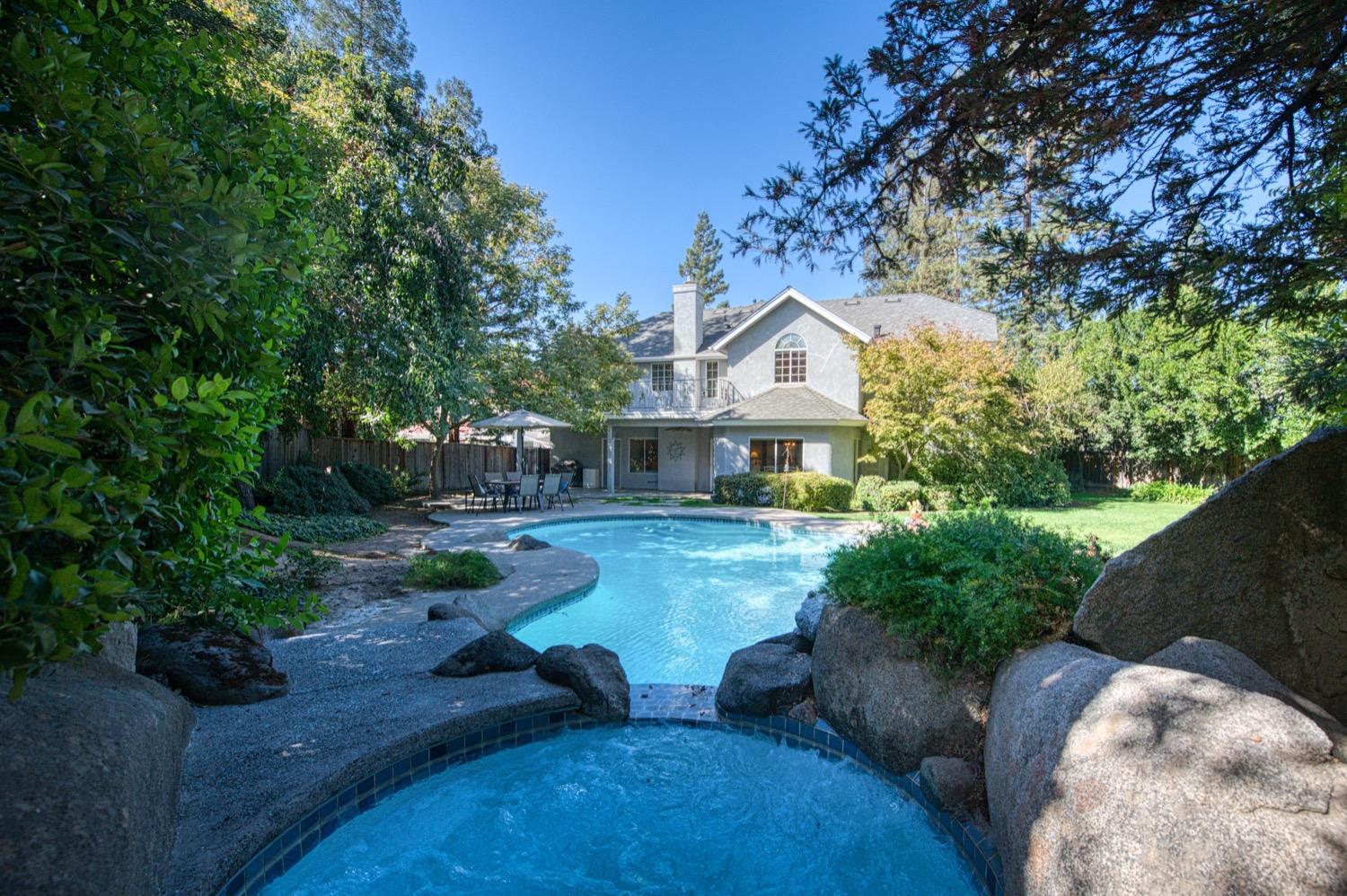 205 West Ridgepoint Drive Fresno, CA 93711 - Photo 45 of 49 a front view of a house with garden