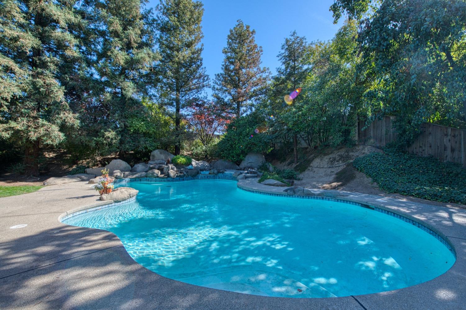 205 West Ridgepoint Drive Fresno, CA 93711 - Photo 46 of 49 a view of a backyard with sitting area