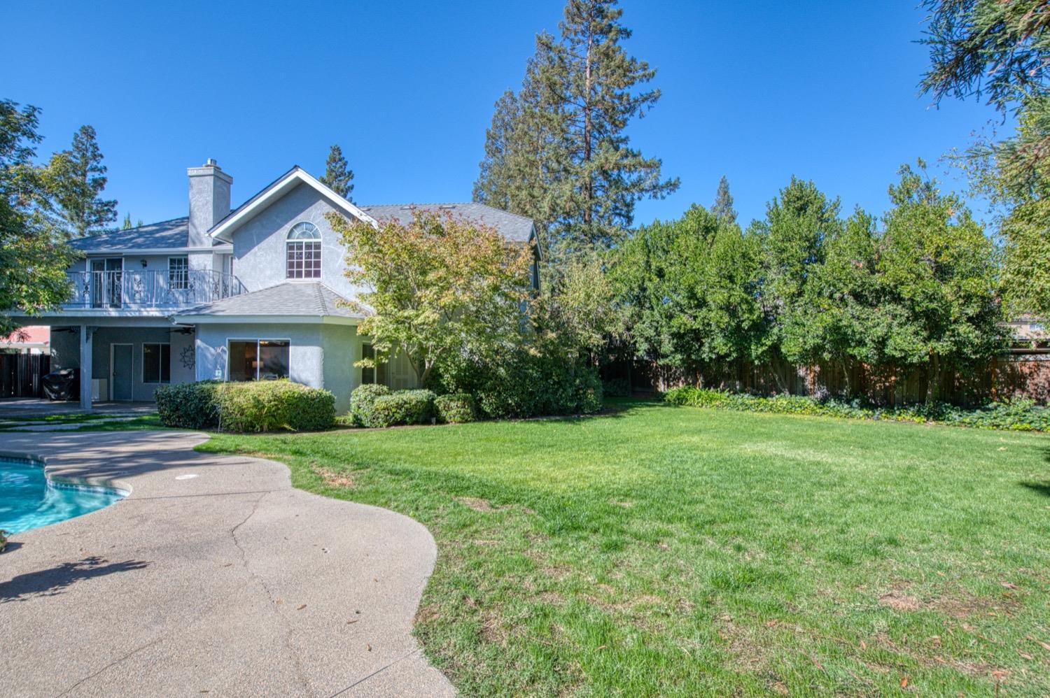 205 West Ridgepoint Drive Fresno, CA 93711 - Photo 48 of 49 a front view of a house with a yard and trees
