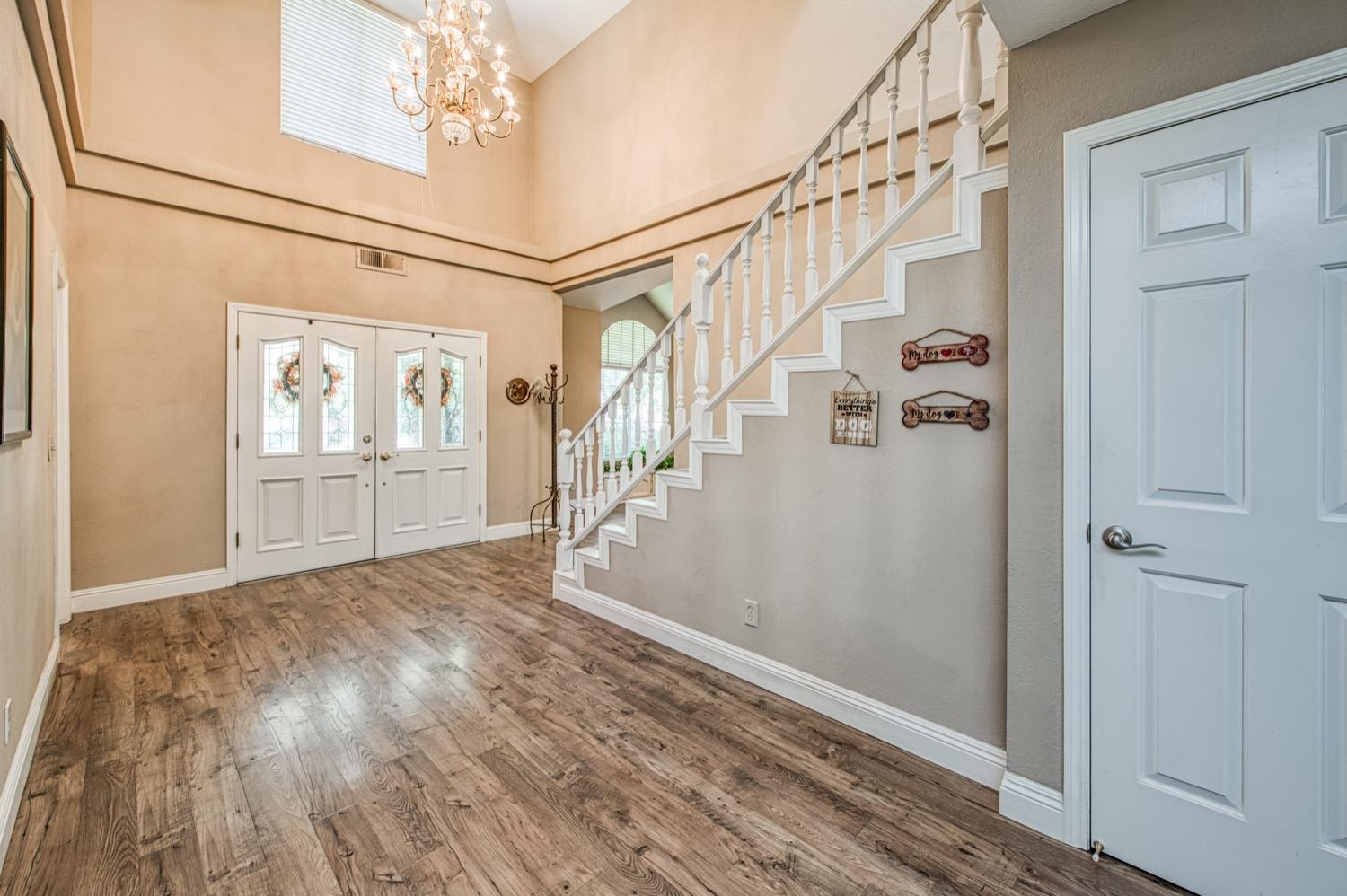 205 West Ridgepoint Drive Fresno, CA 93711 - Photo 7 of 49 a view of an entryway with wooden floor