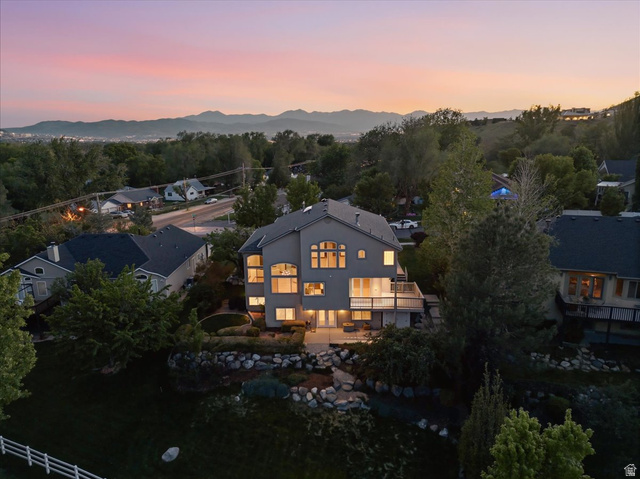 12317 Cypress Point Way Draper, UT 84020 - Photo 41 of 41 Multi-level residence featuring a light-toned exterior, prominent arched windows, and a lower-level deck