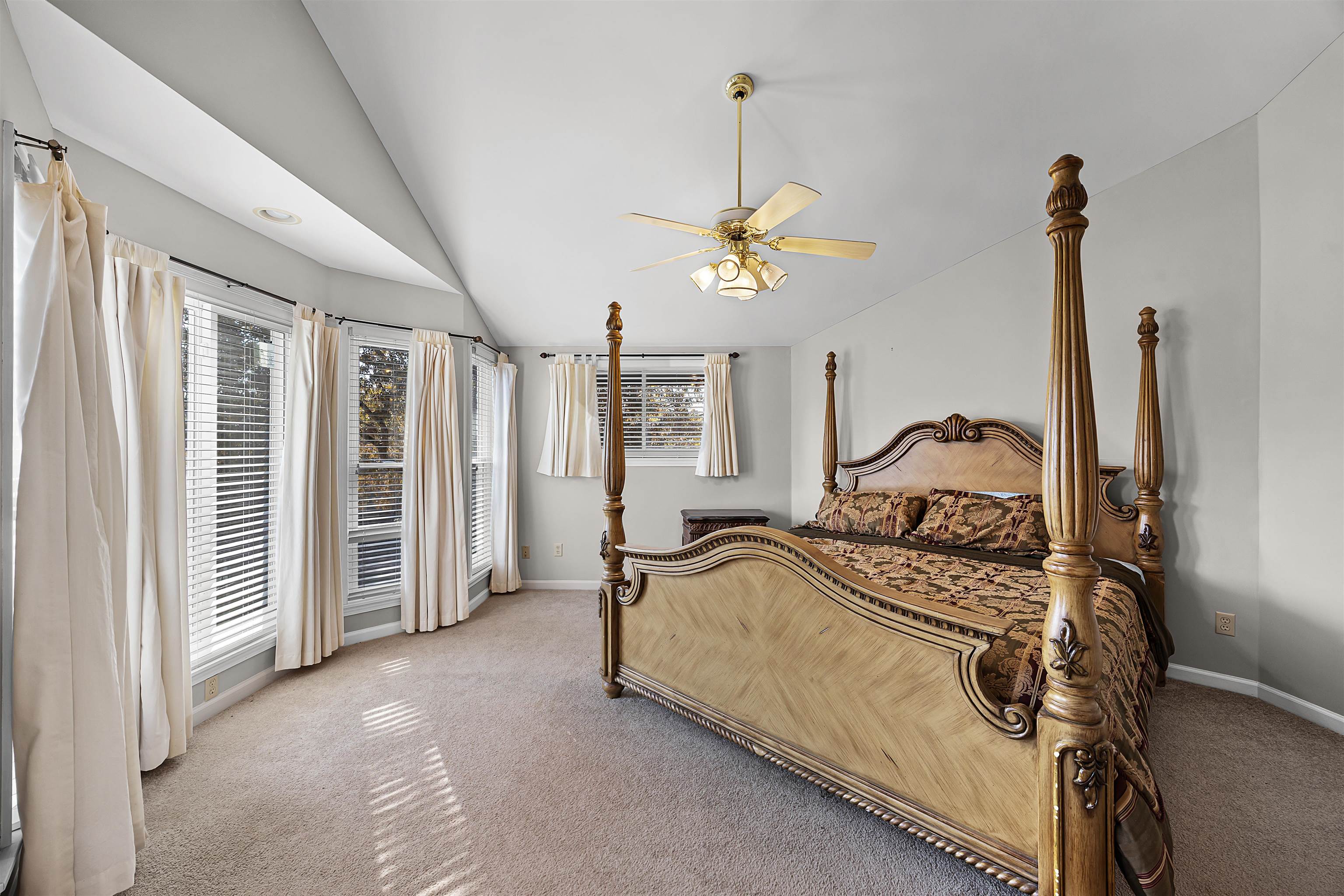 80 Riviera Cove Cherokee, AL 35616 - Photo 11 of 31 a bedroom with a bed and a chandelier