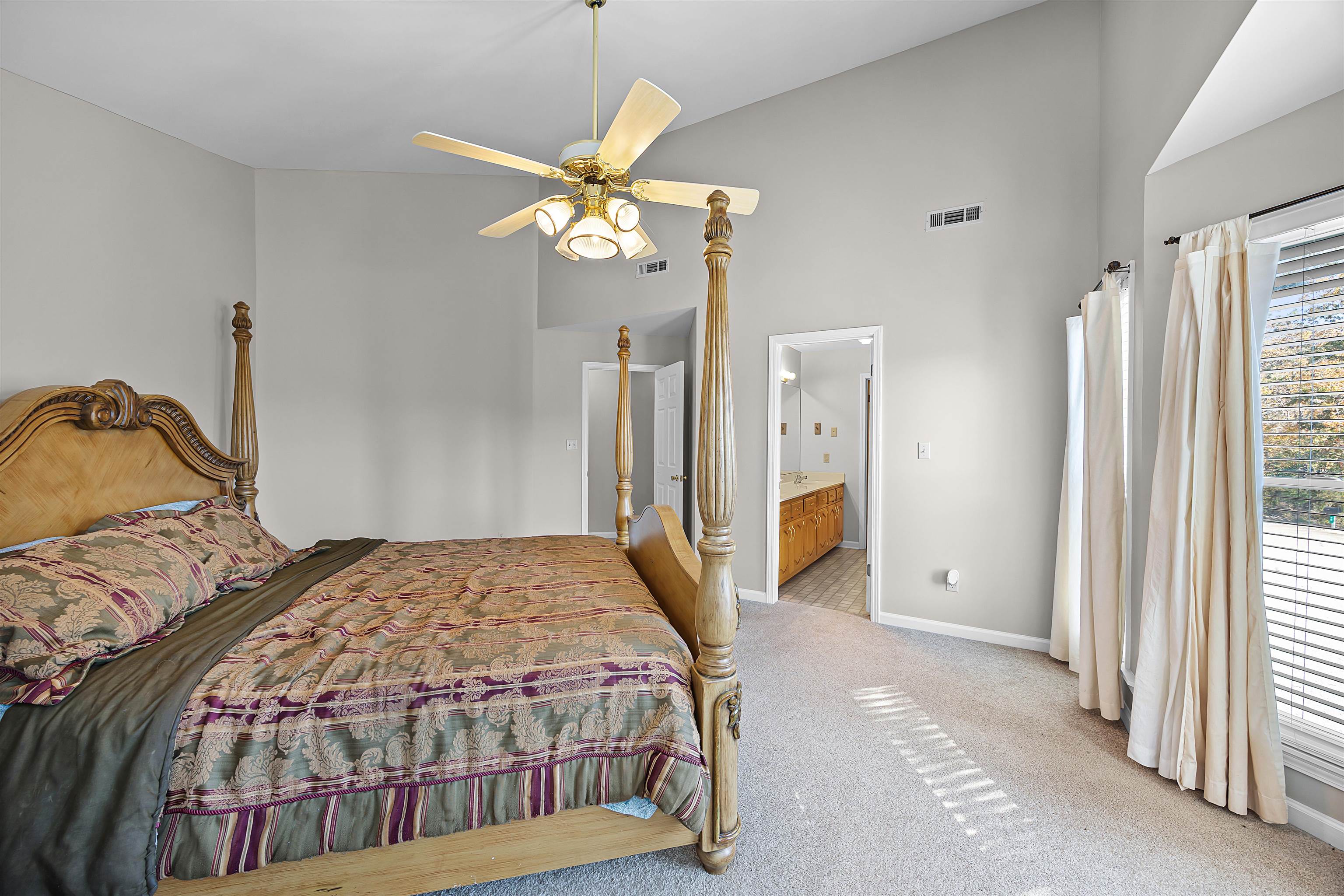 80 Riviera Cove Cherokee, AL 35616 - Photo 12 of 31 a bedroom with a bed and a chandelier