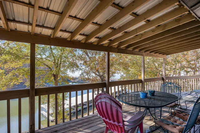 a view of balcony with mountain view and wooden floor