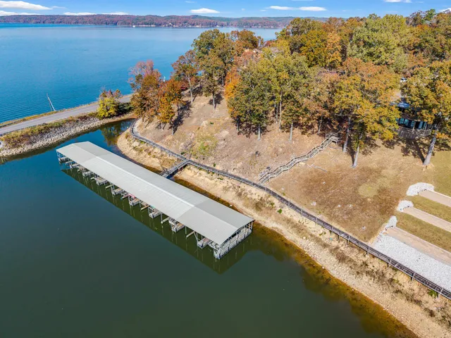 an aerial view of a house with a lake view