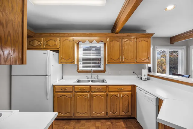a bathroom with a sink a mirror and a window
