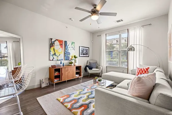 a living room with furniture and a window