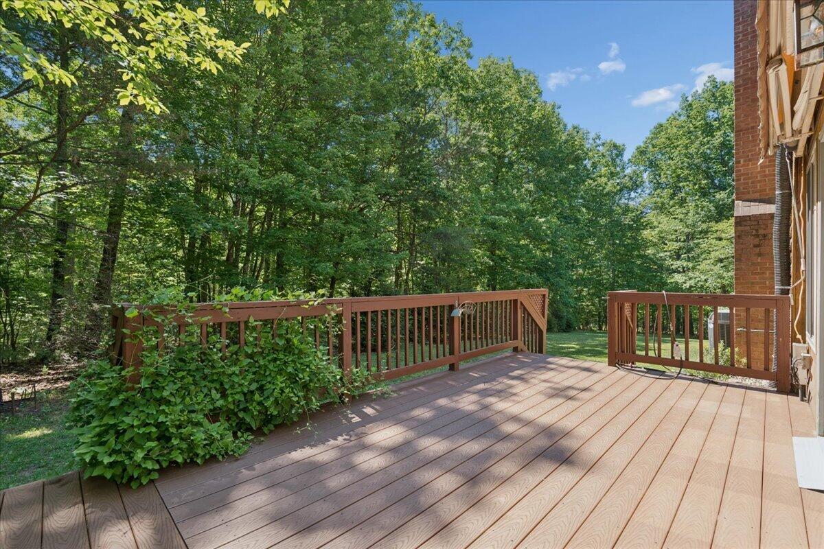 431 Langdon Road Evington, VA 24550 - Photo 37 of 54 a balcony with wooden floor and fence