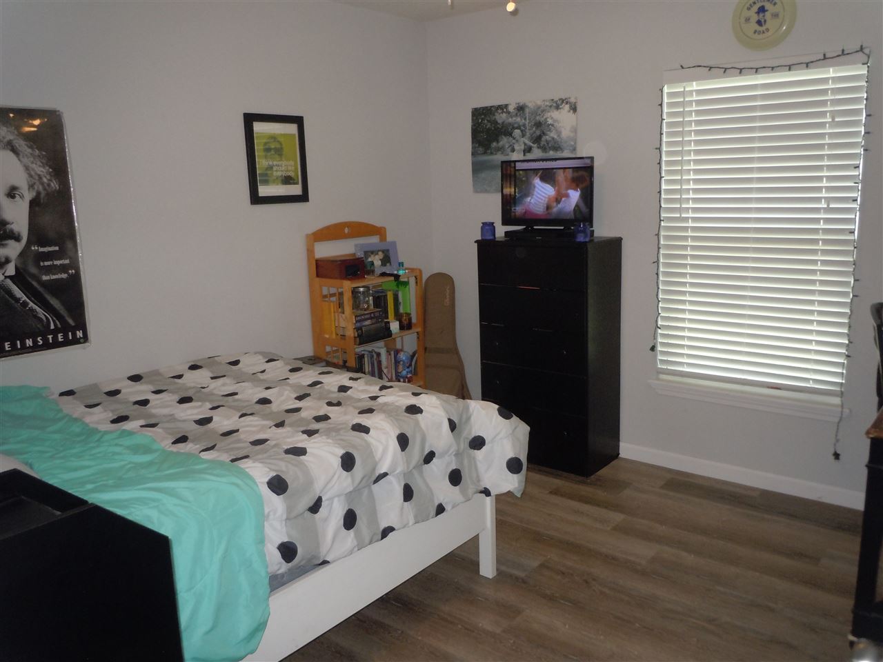 66 Julia Street St. Augustine, FL 32084 - Photo 13 of 26 a bedroom with a bed and wooden floor