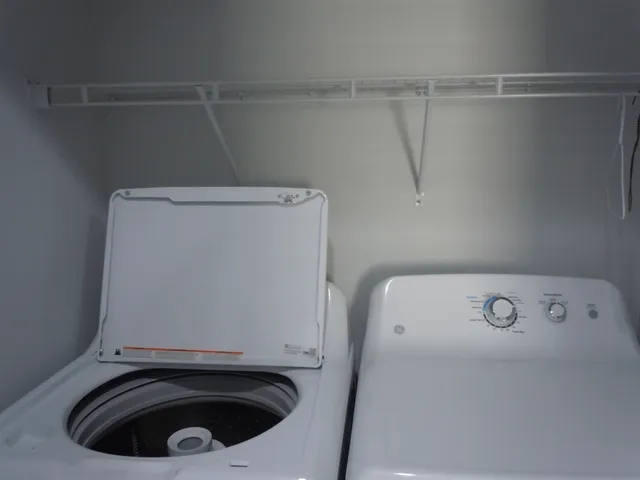 a utility room with dryer and washer