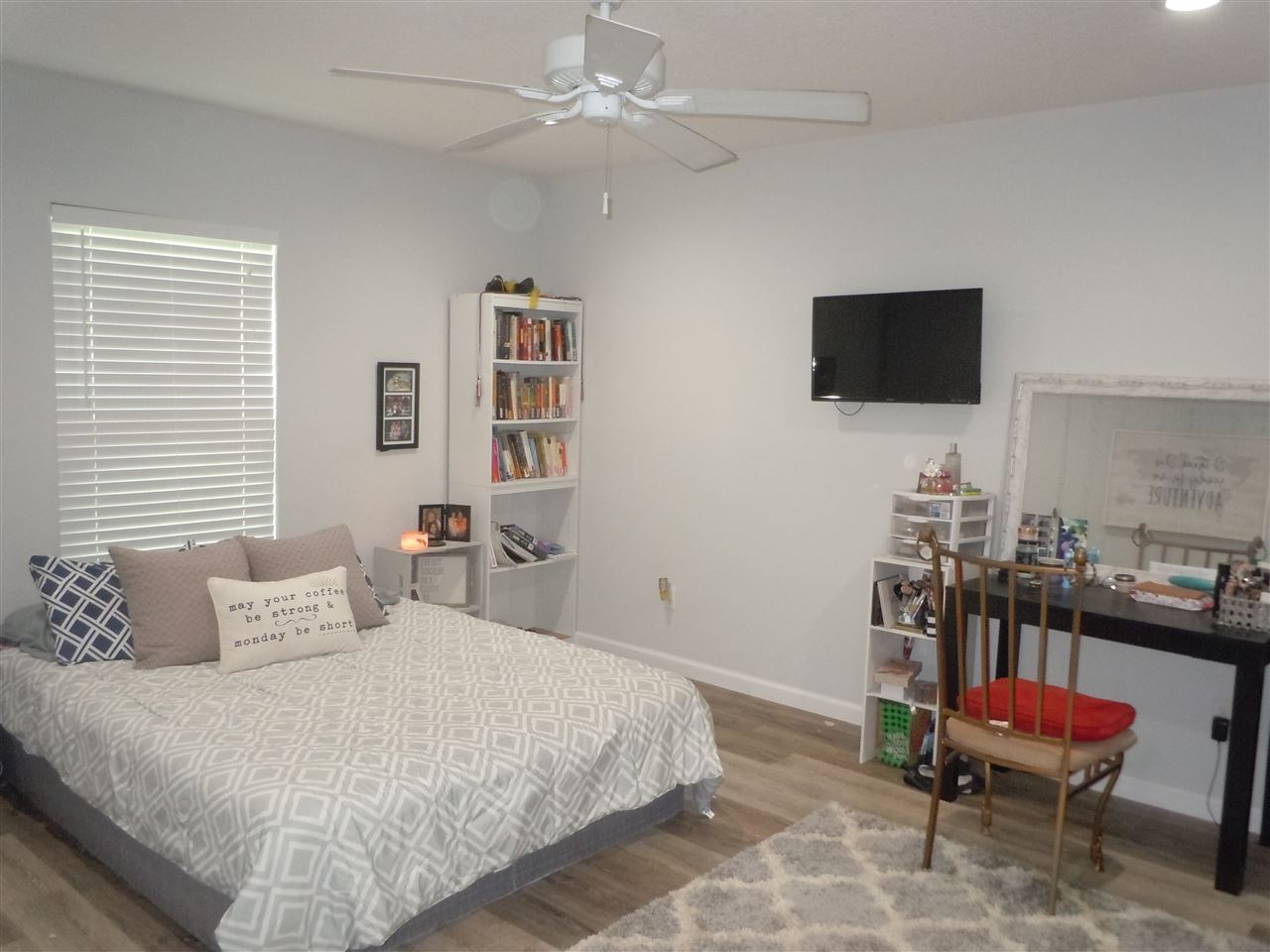 66 Julia Street St. Augustine, FL 32084 - Photo 21 of 26 a bedroom with a bed and a flat screen tv