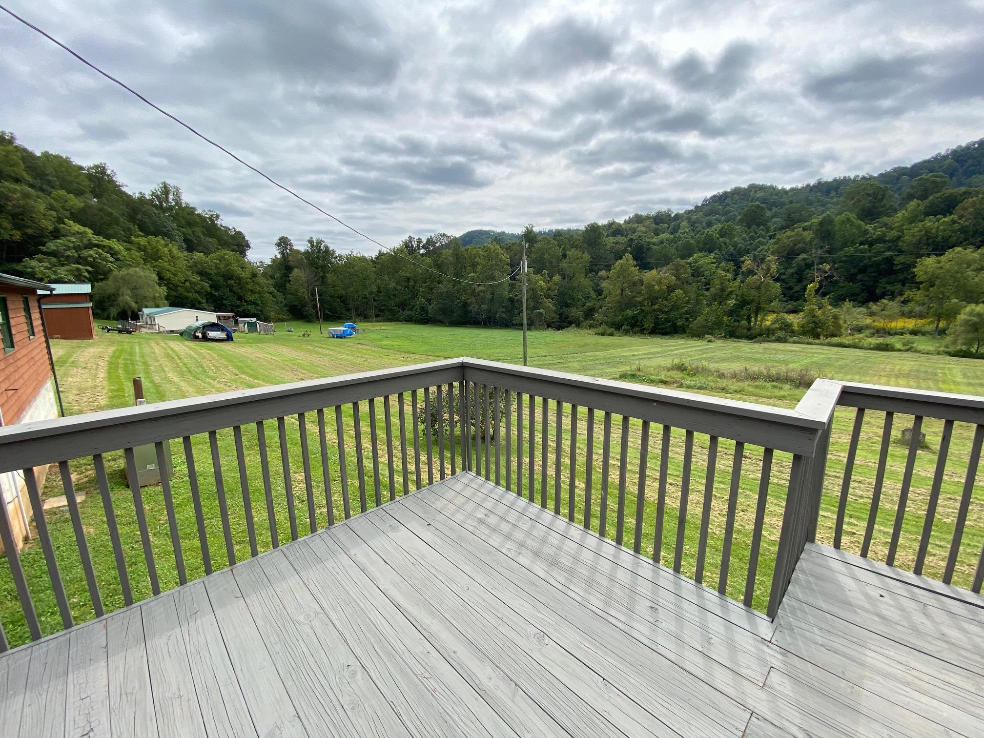 4655 Dillons Mill Road Callaway, VA 24067 - Photo 5 of 15 a balcony with wooden floor and fence