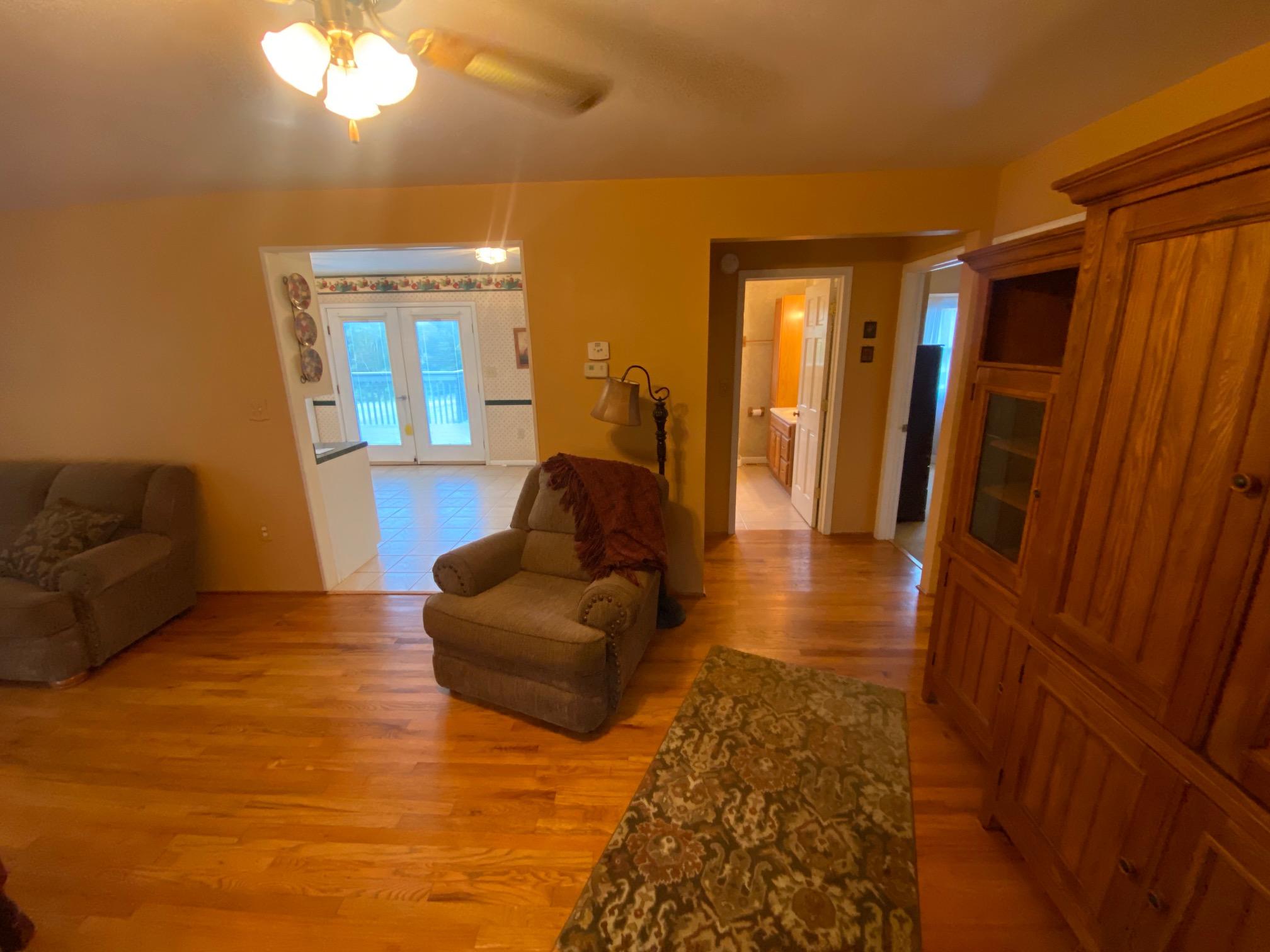 4655 Dillons Mill Road Callaway, VA 24067 - Photo 7 of 15 a living room with couches and painted walls with wooden floor