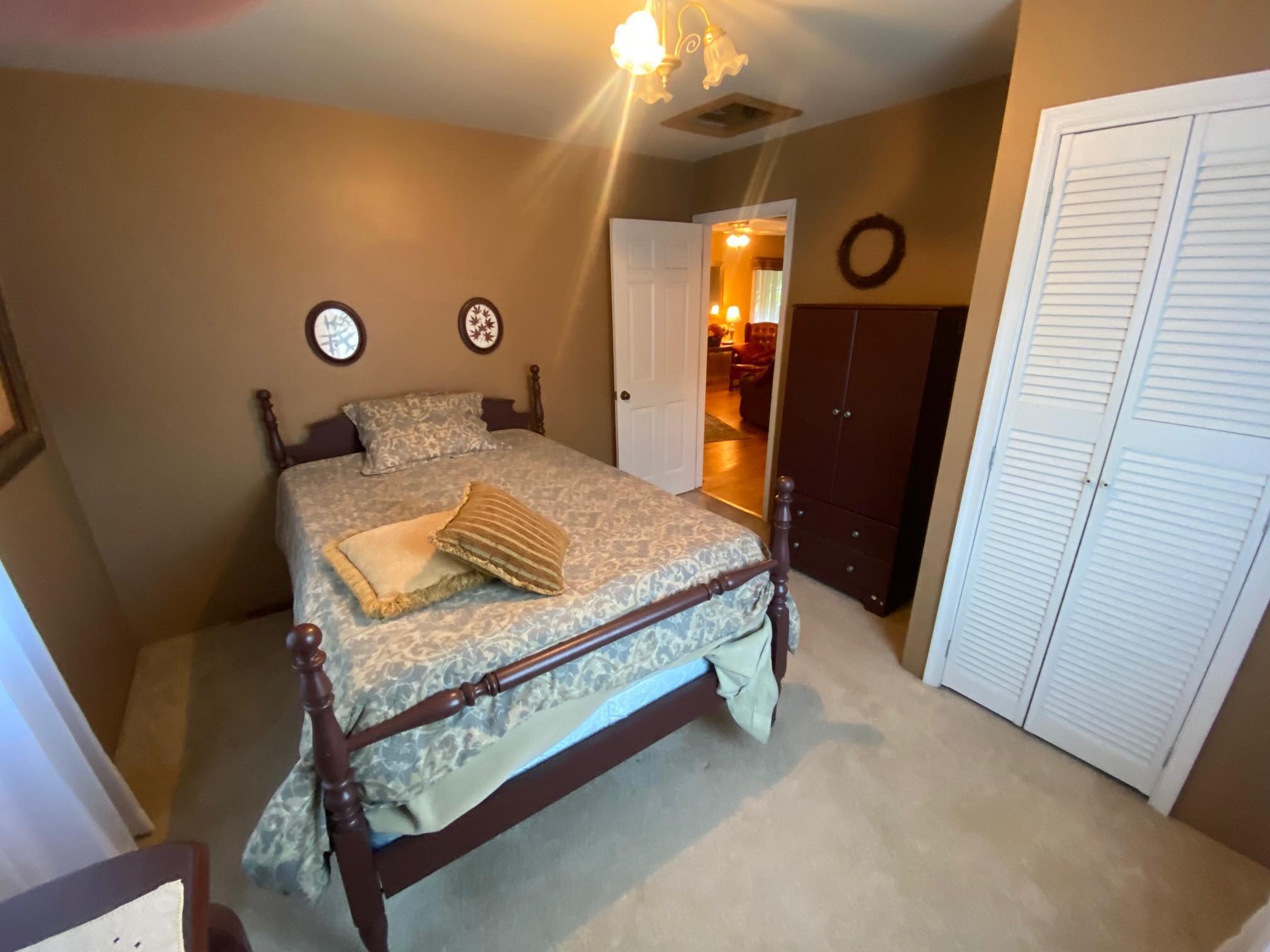 4655 Dillons Mill Road Callaway, VA 24067 - Photo 10 of 15 a bedroom with a bed and cabinets