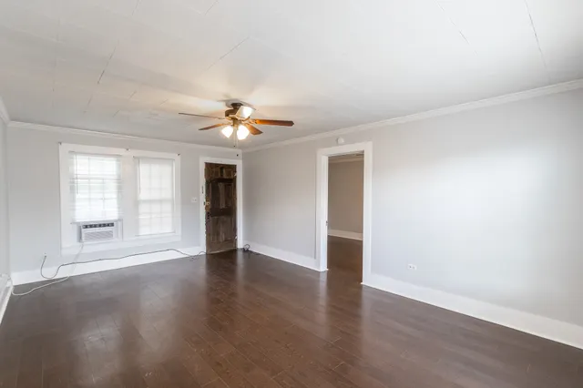 a view of a kitchen with wooden floor