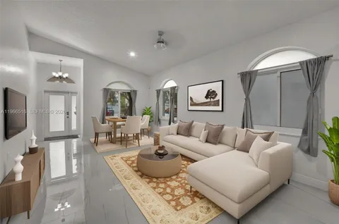a living room with furniture and a flat screen tv