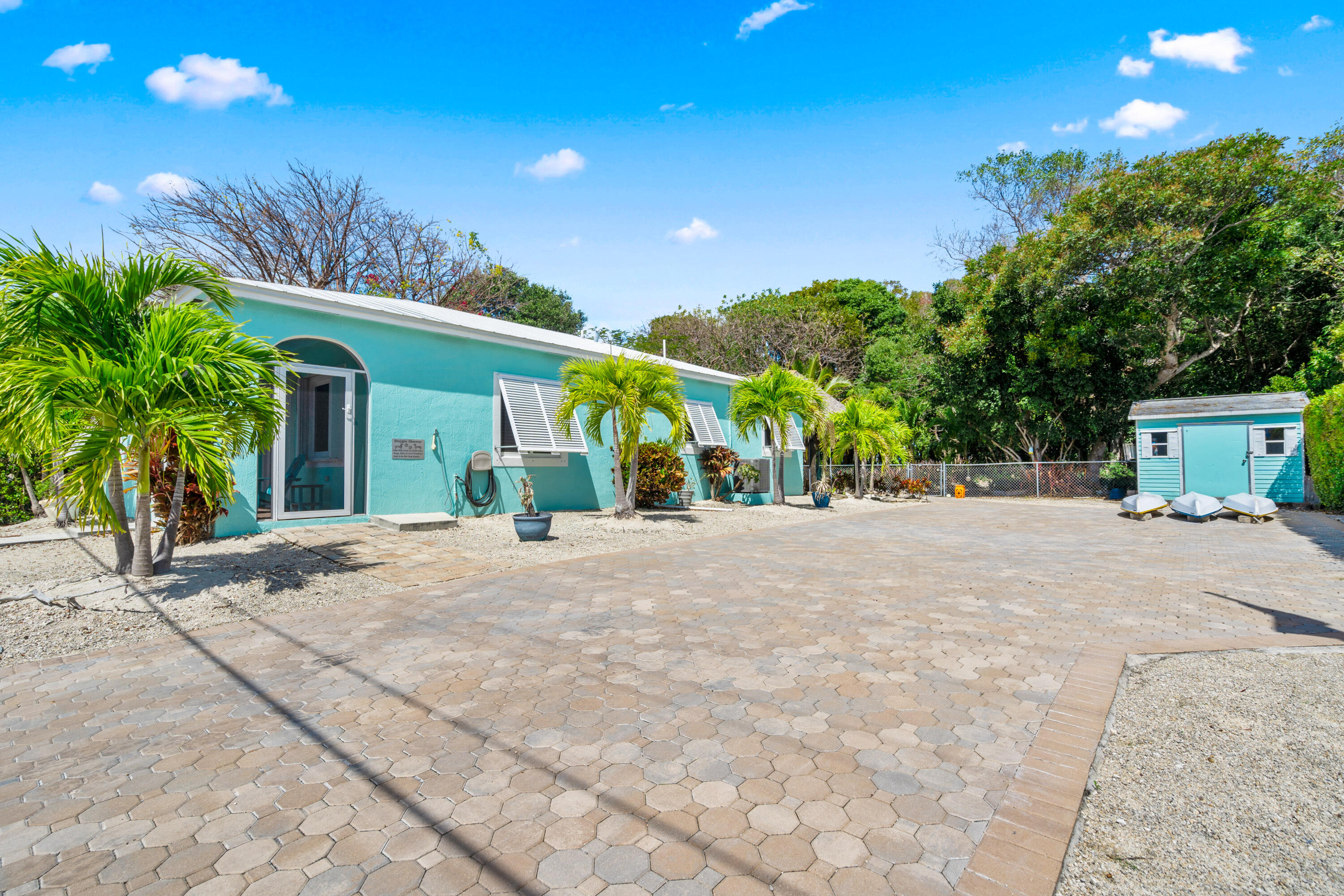 312 Ryan Avenue Key Largo, FL 33037 - Photo 1 of 47 a view of a house with palm trees