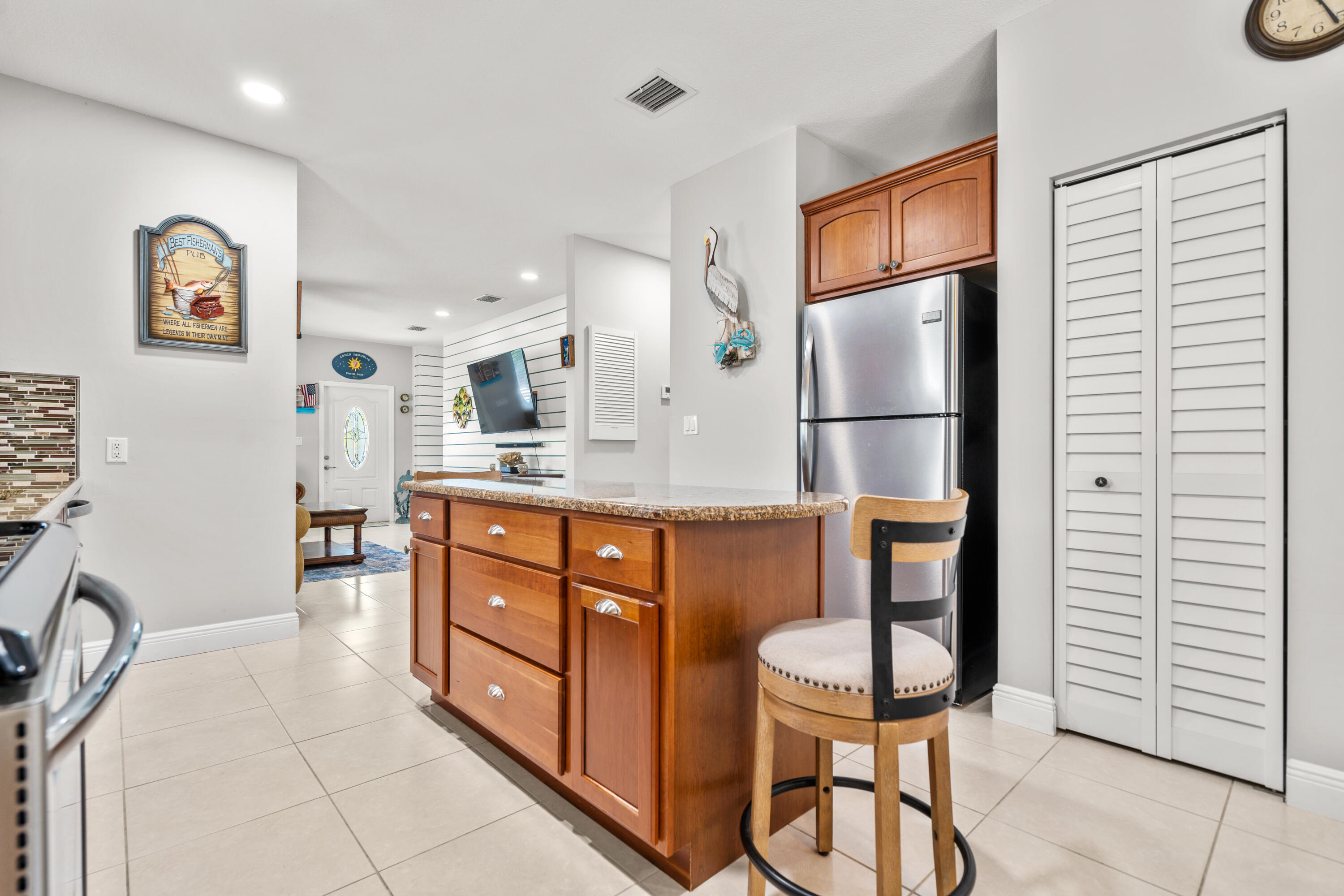 312 Ryan Avenue Key Largo, FL 33037 - Photo 12 of 47 a kitchen with stainless steel appliances granite countertop a refrigerator and a sink