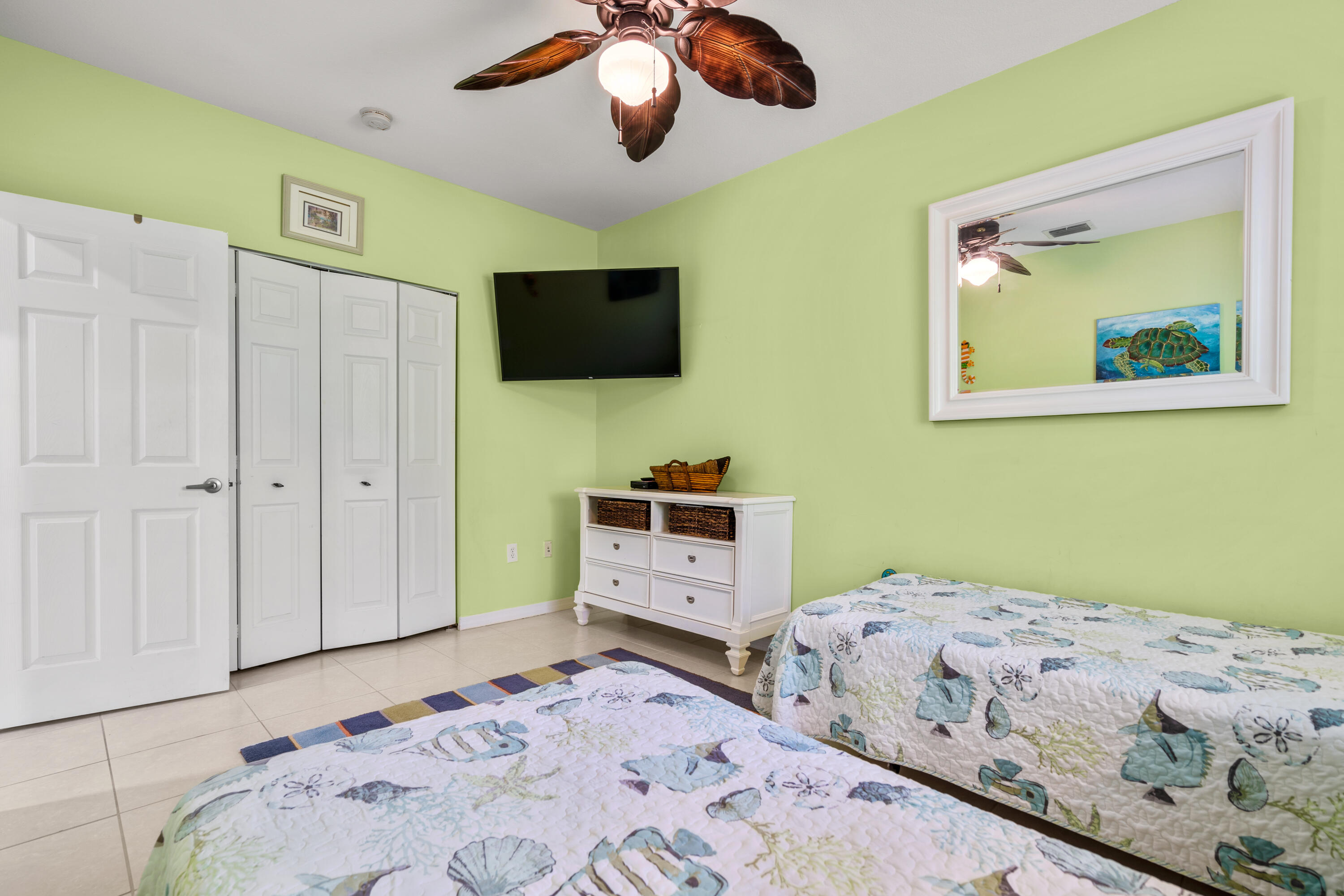 312 Ryan Avenue Key Largo, FL 33037 - Photo 23 of 47 a bedroom with a bed and a flat screen tv