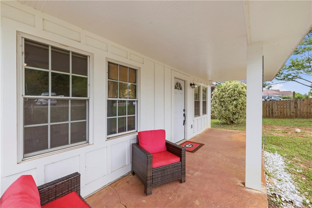 156 Pine Avenue Commerce, GA 30529 - Photo 2 of 35 a view of living room with furniture and windows