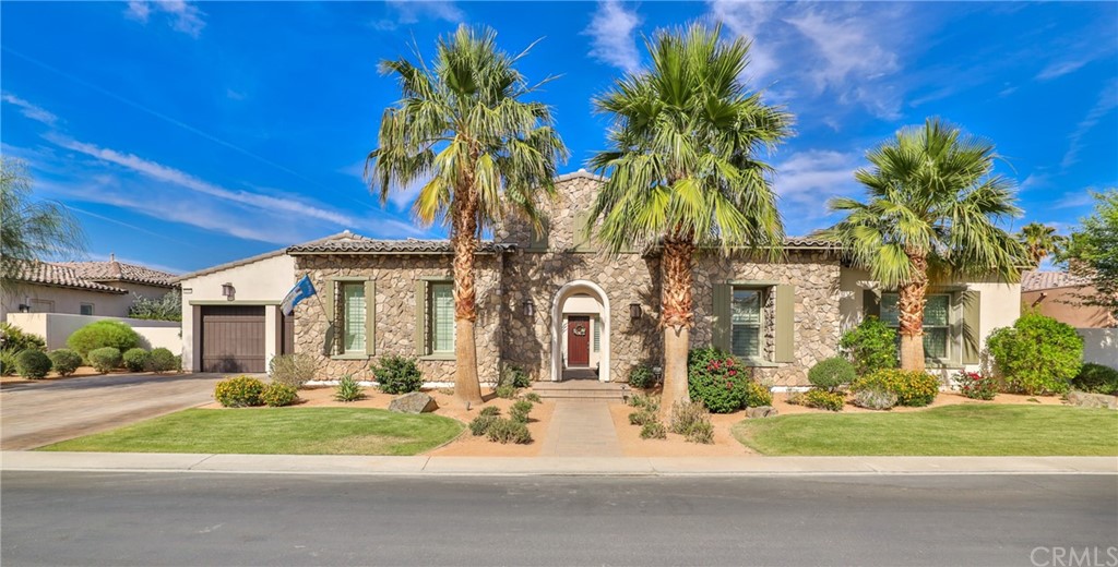 81094 Monarchos Circle La Quinta, CA 92253 - Photo 2 of 43 a view of a white house with a yard in front of it