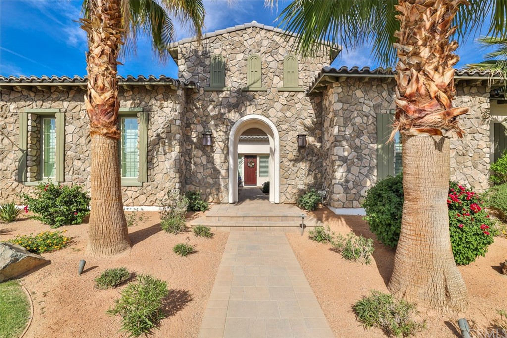 81094 Monarchos Circle La Quinta, CA 92253 - Photo 3 of 43 front view of a house with a yard