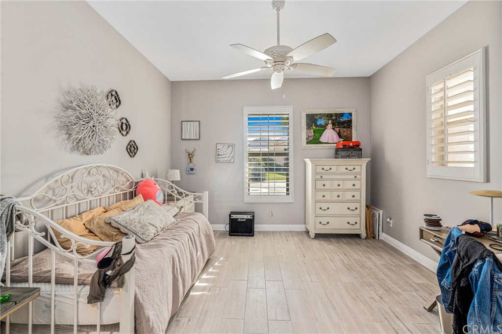 81094 Monarchos Circle La Quinta, CA 92253 - Photo 21 of 43 a bedroom with a bed and a chandelier