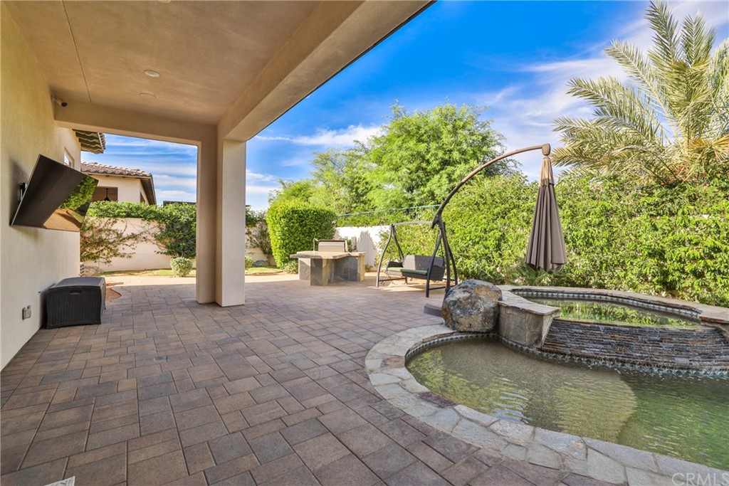 81094 Monarchos Circle La Quinta, CA 92253 - Photo 26 of 43 a view of a swimming pool with a patio