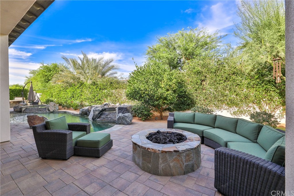 81094 Monarchos Circle La Quinta, CA 92253 - Photo 28 of 43 a view of a patio with couches and a potted plant