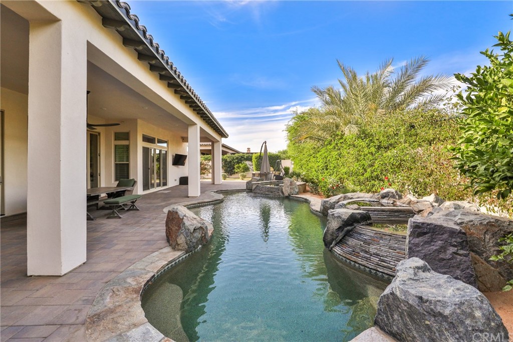 81094 Monarchos Circle La Quinta, CA 92253 - Photo 30 of 43 a swimming pool with outdoor seating and plants
