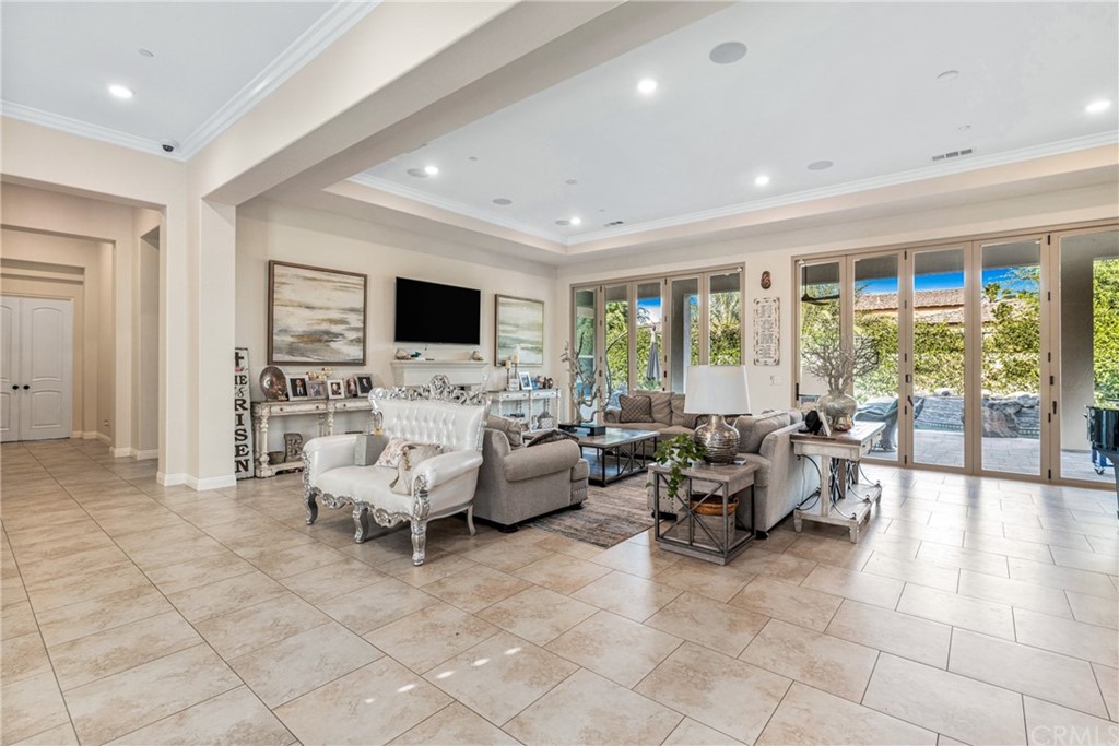 81094 Monarchos Circle La Quinta, CA 92253 - Photo 4 of 43 a living room with furniture and large windows
