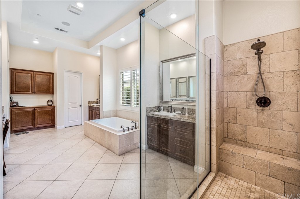 81094 Monarchos Circle La Quinta, CA 92253 - Photo 10 of 43 a large bedroom with a bed and a view of living room