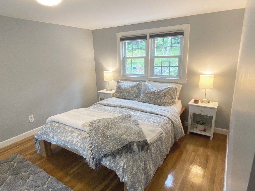 13 Pine Knoll Road Lexington, MA 02420 - Photo 11 of 24 a bedroom with a bed and a window