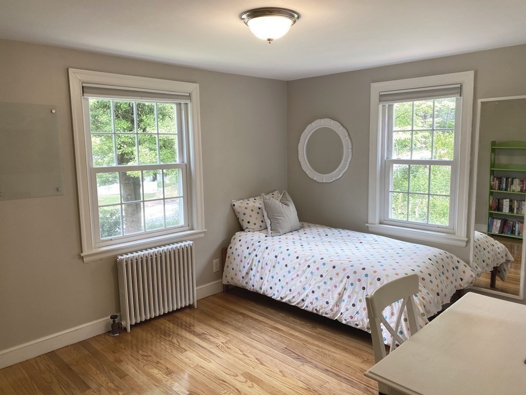 13 Pine Knoll Road Lexington, MA 02420 - Photo 17 of 24 a bedroom with a bed and a window