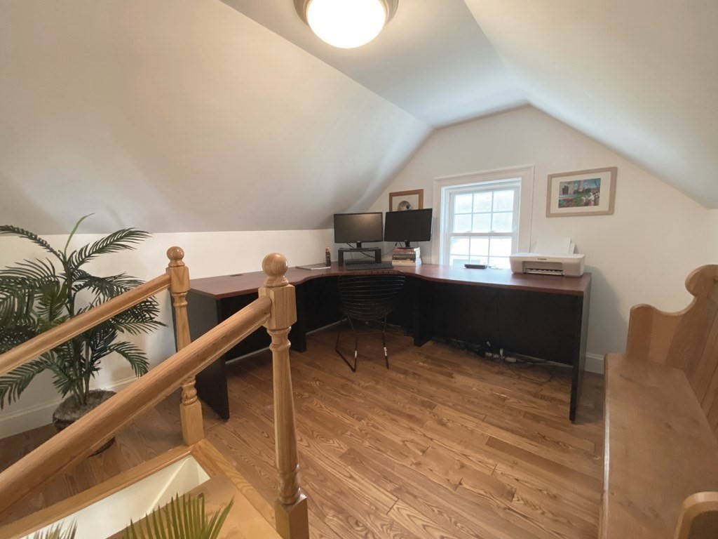 13 Pine Knoll Road Lexington, MA 02420 - Photo 22 of 24 a kitchen with kitchen island cabinets and wooden floor