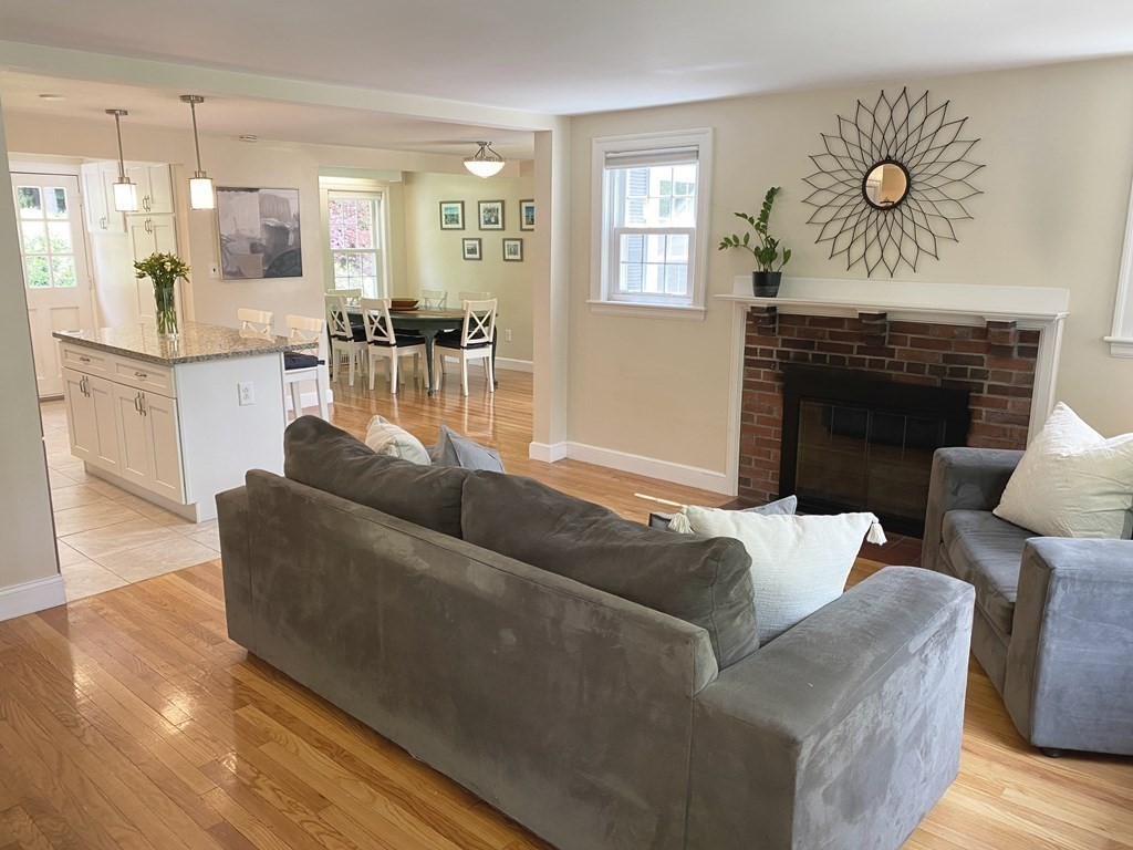 13 Pine Knoll Road Lexington, MA 02420 - Photo 3 of 24 a living room with furniture and a fireplace